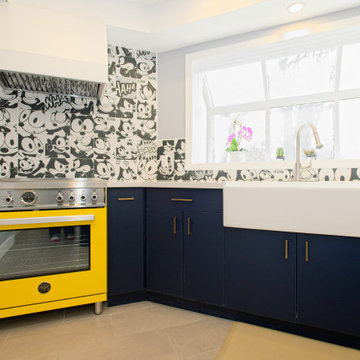 Yellow Range and Farmhouse Sink in a Graphic Blue Kitchen | Thornhill