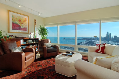 Inspiration for a small eclectic formal and open concept carpeted living room remodel in Chicago with beige walls and no fireplace