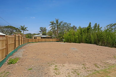 This is an example of a large traditional backyard garden for spring in Brisbane.
