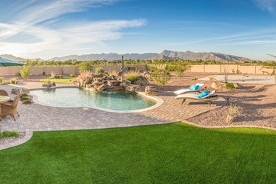 Photo of a large full sun backyard gravel outdoor basketball/tennis/multi-game court in Phoenix for summer.