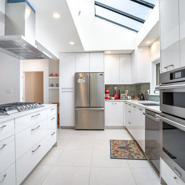 Modern Kerrisdale Kitchen with Skylight, Island Cooktop and Built-In Ovens