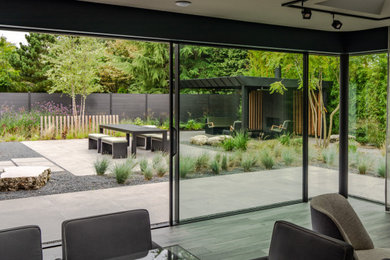 This is an example of a contemporary patio in Manchester.