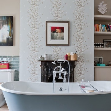 Statement freestanding bath in front of fireplace