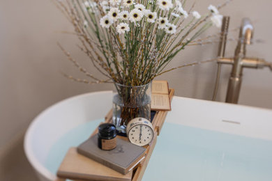 Mid-sized french country master brown tile and porcelain tile porcelain tile, brown floor and double-sink bathroom photo in Other with beaded inset cabinets, light wood cabinets, a two-piece toilet, brown walls, an undermount sink, quartz countertops, a hinged shower door, white countertops and a built-in vanity