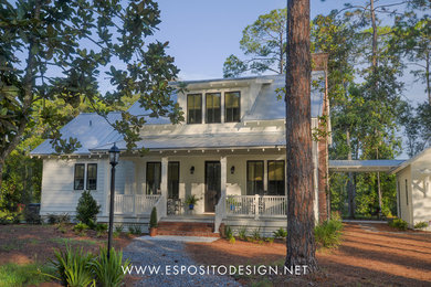 Inspiration for a mid-sized country white two-story concrete fiberboard exterior home remodel in Jacksonville with a metal roof