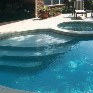 Pool, waterfall, and landscaping