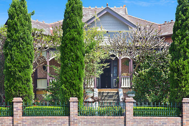 Traditional one-storey brick red house exterior in Newcastle - Maitland.