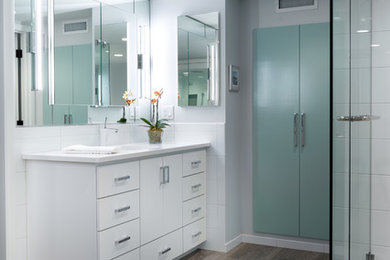 Inspiration for a large contemporary master white tile and ceramic tile porcelain tile bathroom remodel in Portland with an undermount sink, flat-panel cabinets, white cabinets, quartz countertops and gray walls
