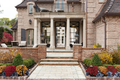Inspiration for a huge two-story brick exterior home remodel in Chicago