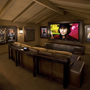 Inspiration for a rustic enclosed home cinema in Los Angeles with a built-in media unit.
