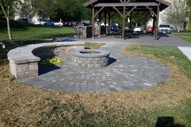 Photo of a large traditional patio in Raleigh with natural stone pavers.