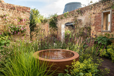 Design ideas for a medium sized rural back garden in Kent.