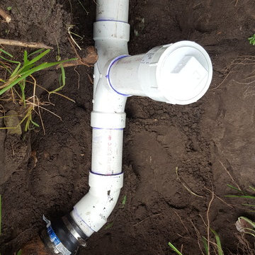 Unclogged a sewer line and installed a new clean out.
