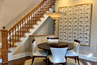 Inspiration for a mid-sized traditional dining room in DC Metro with beige walls, dark hardwood floors and brown floor.