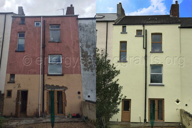 Photo of a medium sized and yellow contemporary render terraced house in Cardiff with three floors.