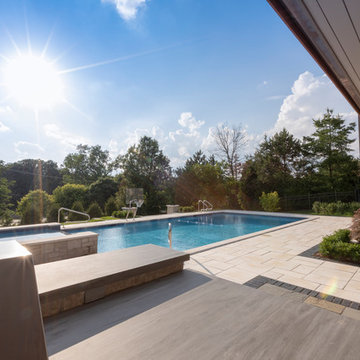 Burr Ridge Lap Pool with Raised Hot Tub and Waterfall