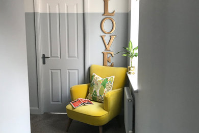 Inspiration for a mid-sized contemporary carpeted and multicolored floor hallway remodel in Other with blue walls