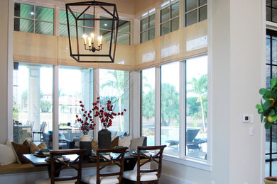Kitchen/dining room combo - contemporary kitchen/dining room combo idea in Miami with white walls