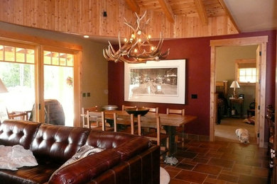 Example of a mid-sized mountain style porcelain tile great room design in Seattle with red walls and no fireplace