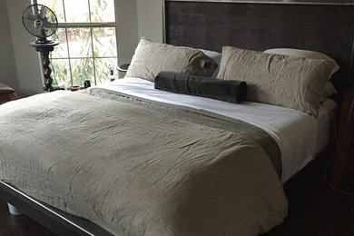 Large trendy master carpeted bedroom photo in Dallas with gray walls and no fireplace