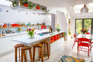 Medium sized modern u-shaped kitchen/diner in Other with flat-panel cabinets, white cabinets, quartz worktops, an island and white worktops.