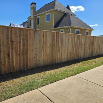 6-Foot Cedar Privacy Fence With Top Cap Installation in Bentonville, AR
