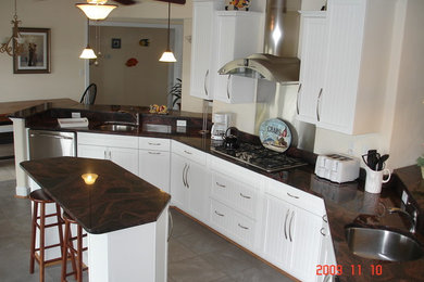 Example of a beach style kitchen design in Other