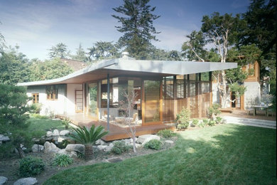 Large zen two-story wood exterior home photo in Los Angeles