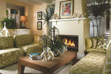 Example of a mid-sized transitional open concept living room design in Miami with beige walls and a standard fireplace