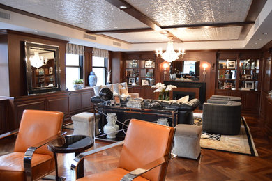 Mid-sized elegant freestanding desk dark wood floor study room photo in New York with white walls and a standard fireplace