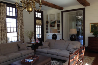 Example of a country family room design in New York