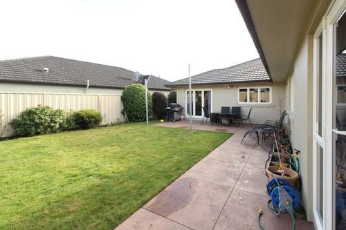 Backyard with retainer wall... what to do?