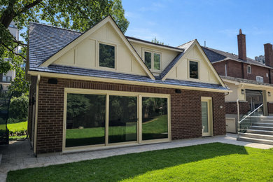 Mid-sized mixed siding exterior home idea in Toronto