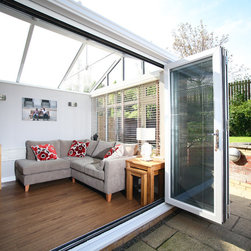 White Conservatory with PVCu Bi-Fold Doors - Products