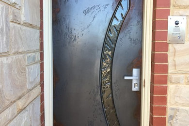Inspiration for an entryway in Adelaide with a single front door.