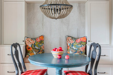 Example of a small beach style light wood floor and beige floor dining room design in Boston
