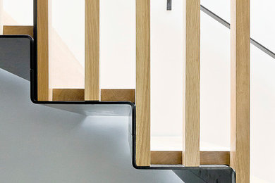 This is an example of a medium sized contemporary floating staircase in London.