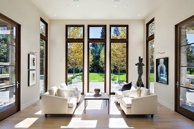 Inspiration for a mid-sized contemporary formal and open concept light wood floor and beige floor living room remodel in San Francisco with beige walls, no fireplace and no tv