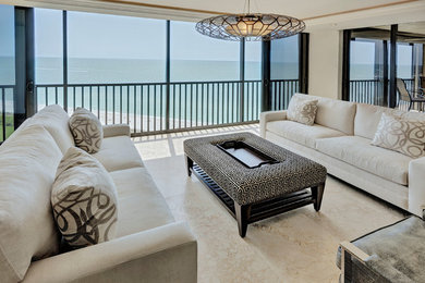 Design ideas for a transitional living room in Miami with white walls.