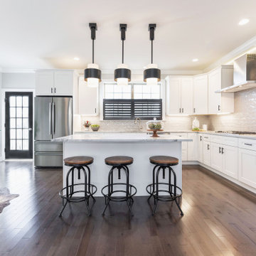 Modern counter stools, oversized pendants in modern townhouse kitchen
