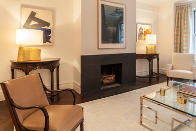 Inspiration for a mid-sized transitional enclosed dark wood floor living room remodel in New York with white walls, a standard fireplace and a stone fireplace