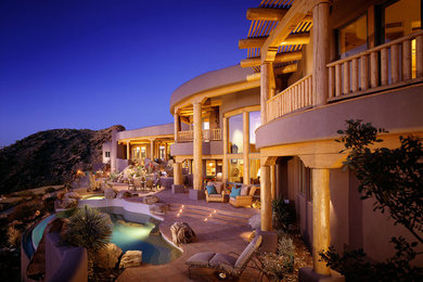 Pool - large backyard concrete infinity pool idea in Phoenix