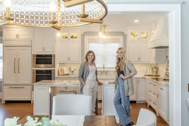 Kitchen - mid-sized contemporary l-shaped medium tone wood floor and gray floor kitchen idea in Cedar Rapids with flat-panel cabinets, white cabinets, multicolored backsplash, stainless steel appliances, an island and multicolored countertops