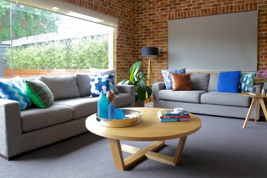 Photo of a large contemporary open concept family room in Sydney with carpet and a freestanding tv.