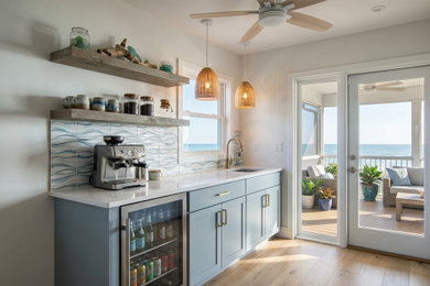Example of a beach style home bar design in DC Metro