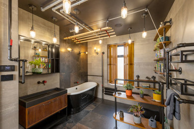 Photo of a large urban family bathroom in Manchester with flat-panel cabinets, dark wood cabinets, wooden worktops, black worktops, a single sink and a floating vanity unit.
