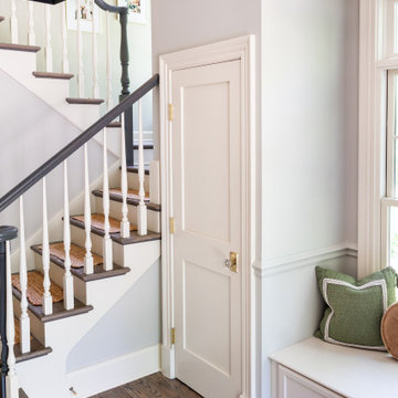 Welcoming Foyer with Built-In Bench and Timeless Trim