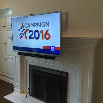 HDTV Mounted over Fireplace with Drop Down Mantel Mount and Hidden Wiring