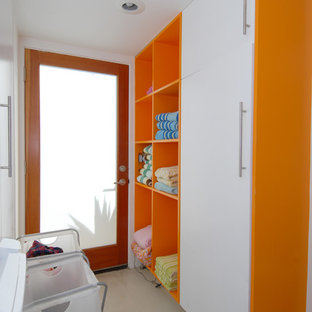 Photo of a contemporary galley utility room in Orange County with open cabinets and orange cabinets.