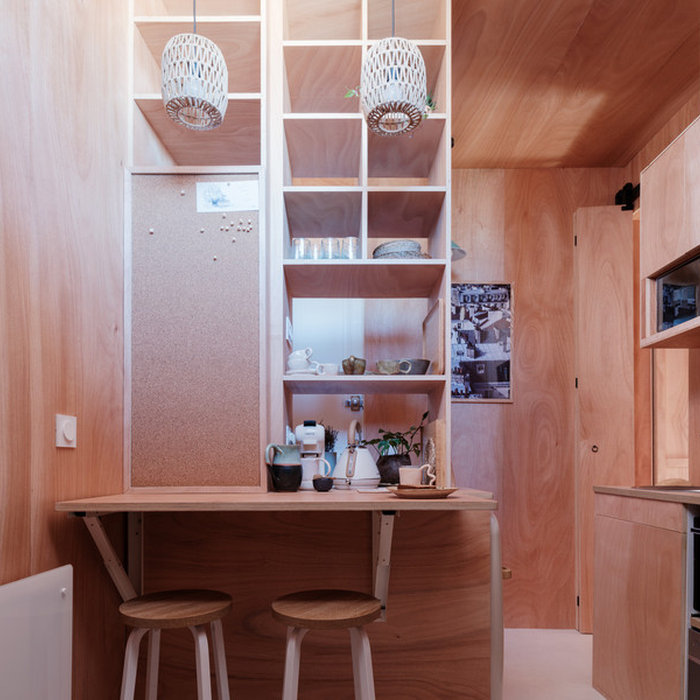 Small asian concrete floor, white floor, wood ceiling and wood wall great room photo in Paris